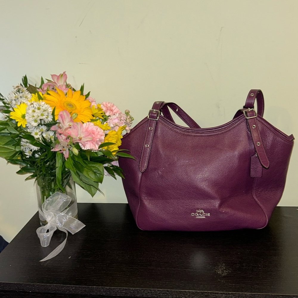 Large plum colored coach shoulder bag